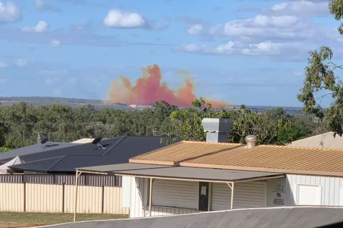 Moranbah residents spotted this bright orange and red plume from a blast at a nearby mine. (Photo: Supplied, Cassie Ranger)