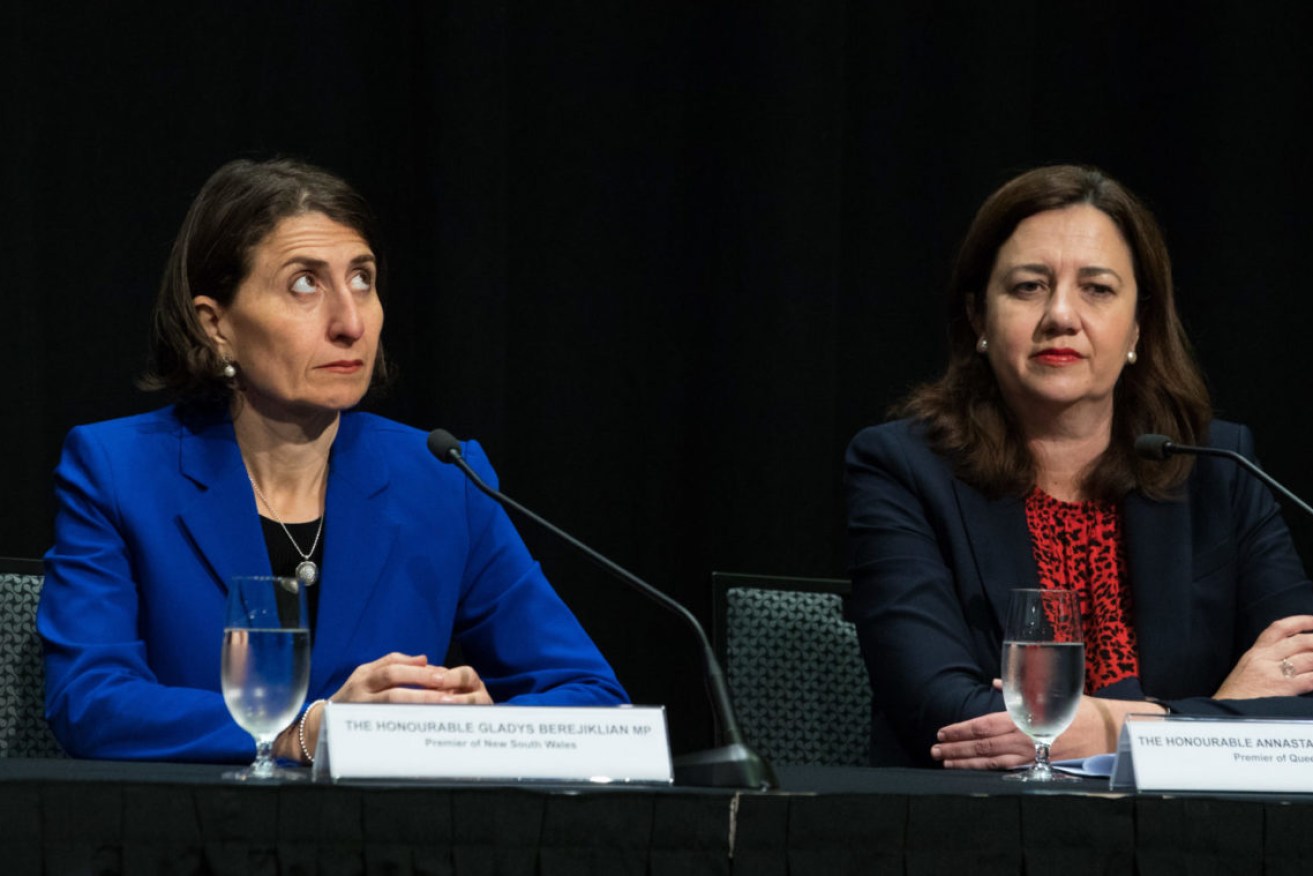 NSW Premier Gladys Berejiklian (left) and Queensland Premier Annastacia Palaszczuk. (Photo: AAP Image/Marc McCormack)