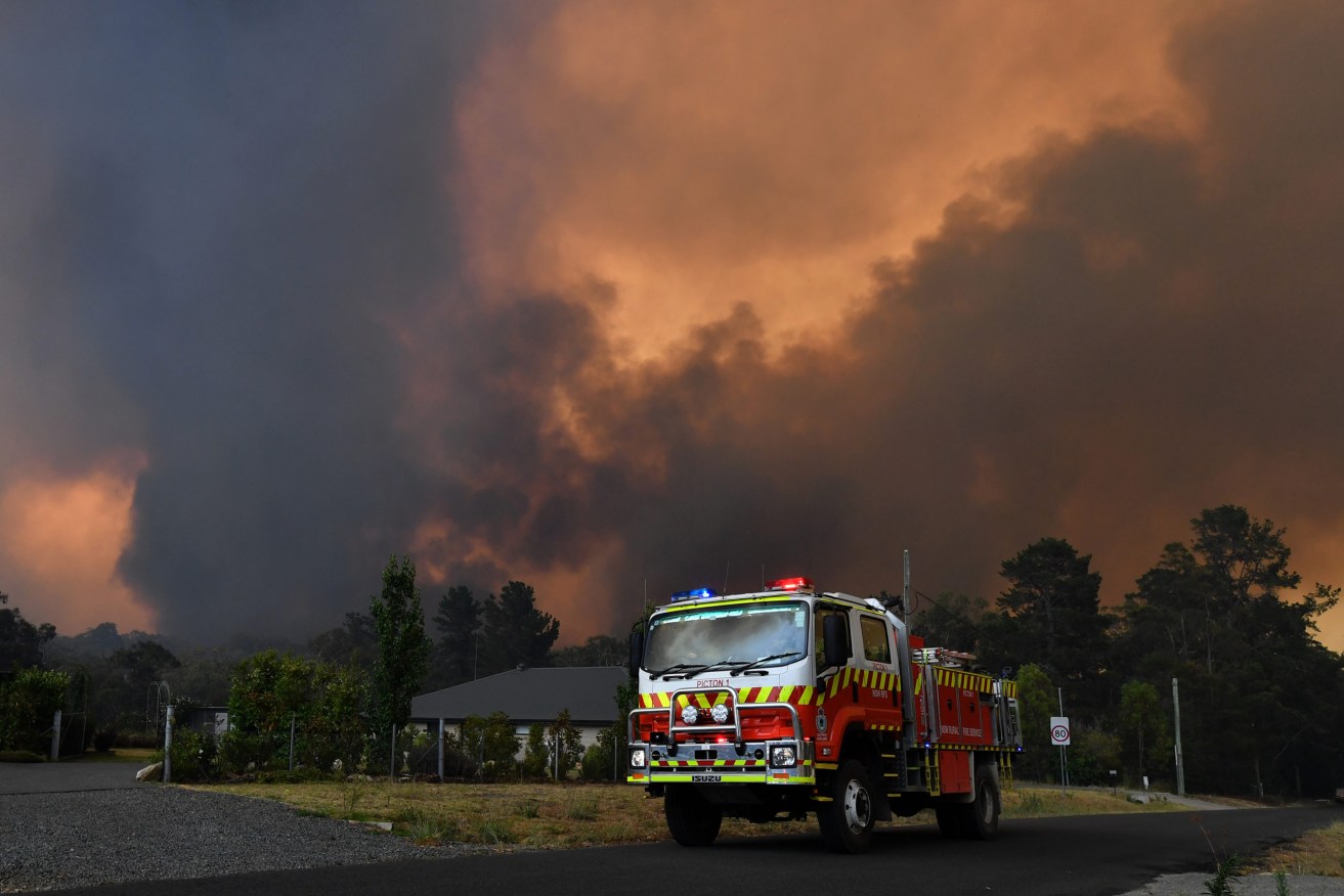 Rural Fire Service (RFS) crews prepare for the Green Wattle Creek Fire as it threatens homes in Yanderra in the south west of Sydney in December. (Photo: AAP Image/Dean Lewins) 