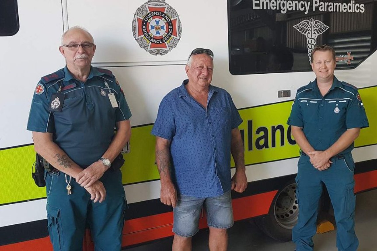 Keith Jackson, centre, was resuscitated by paramedics Frank Smith, left, and Ryan Parrish. (Photo: Supplied: Queensland Ambulance Service)