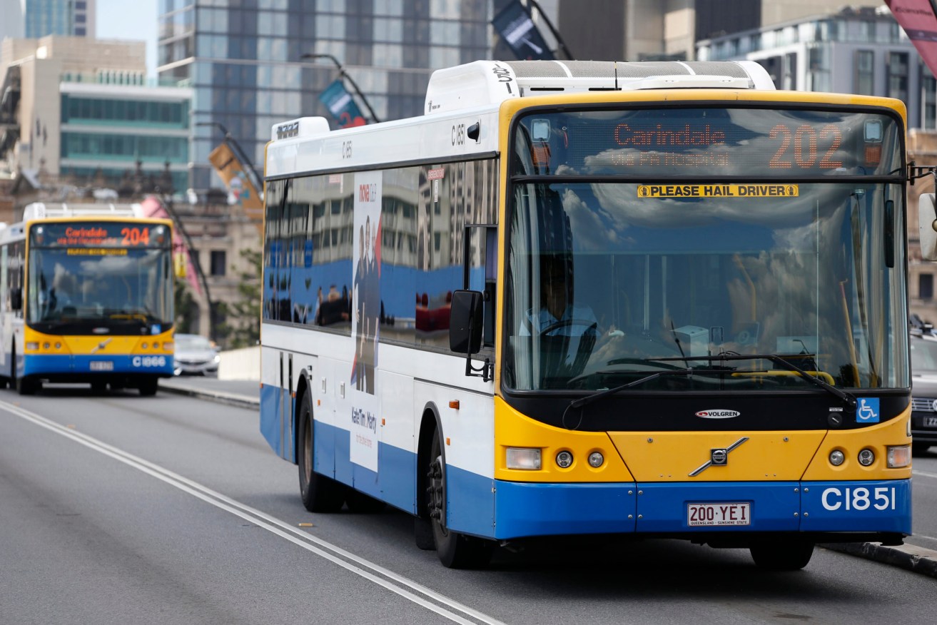 Brisbane commuters are catching later buses to work to avoid crowding - but are doing the opposite on the way home. (Photo: AAP Image/Regi Varghese) 