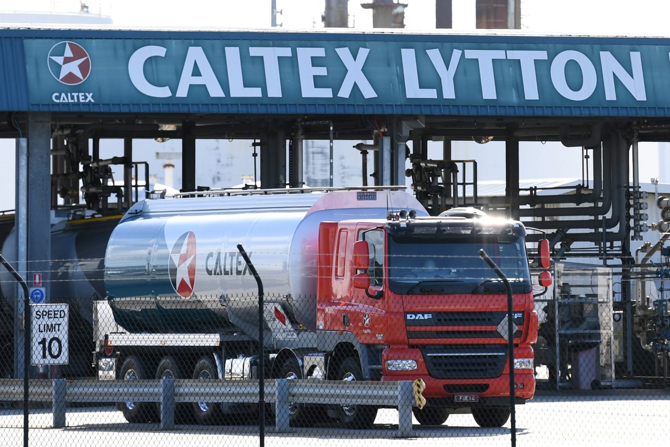 A fuel tanker is seen at the Caltex refinery in Brisbane, Monday, April 6, 2020. Caltex Australia will bring forward and extend the shutdown of its Lytton refinery as the coronavirus pandemic puts pressure on demand. (AAP Image/Dan Peled) NO ARCHIVING