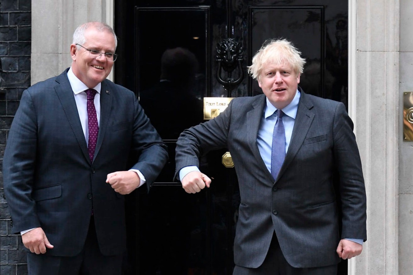 Britain's Prime Minister Boris Johnson, left, greets Australia's Prime Minister Scott Morrison at 10 Downing Street, in London, Monday.(AP Photo/Alberto Pezzali)