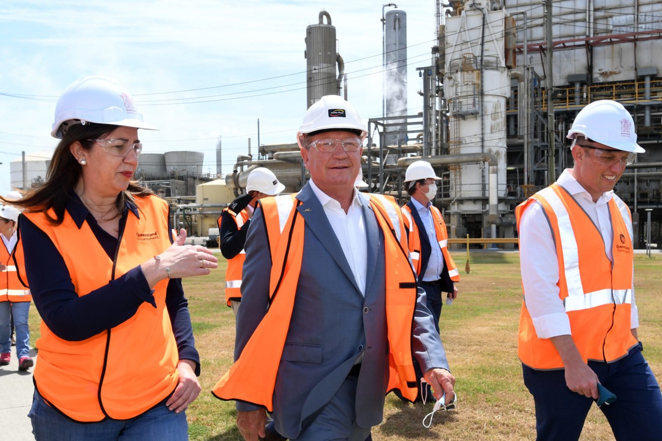 Queensland Premier Annastacia Palaszczuk (left), Andrew 'Twiggy' Forrest (centre) from Fortescue Future Industries and Deputy Premier Steven Miles (right) are seen during a hydrogen announcement at Incitec Pivot on Gibson Island . (AAP Image/Darren England) 