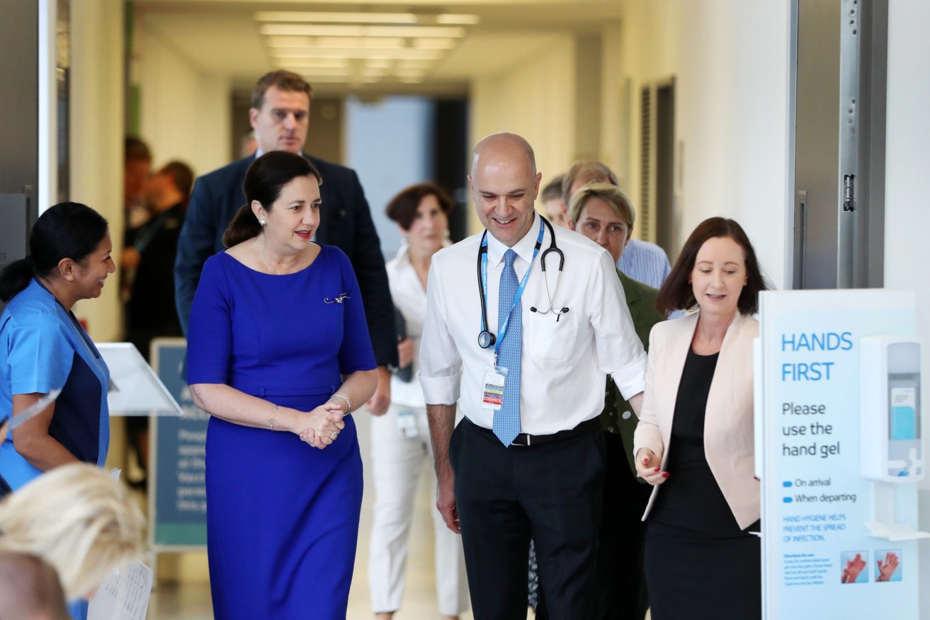Queensland's new chief health officer Dr John Gerrard pictured with Premier Annastacia Palaszczuk and Health Minister Yvette D'Ath.(AAP Image/ Nigel Hallett) 