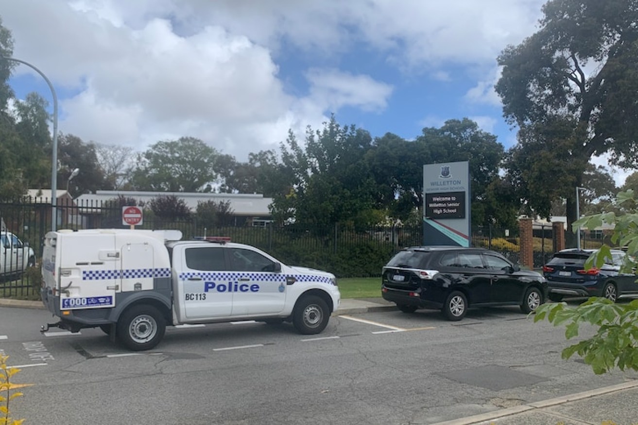 Police vehicles outside the school where two girls plotted to kill their teacher. (Photo: ABC)
