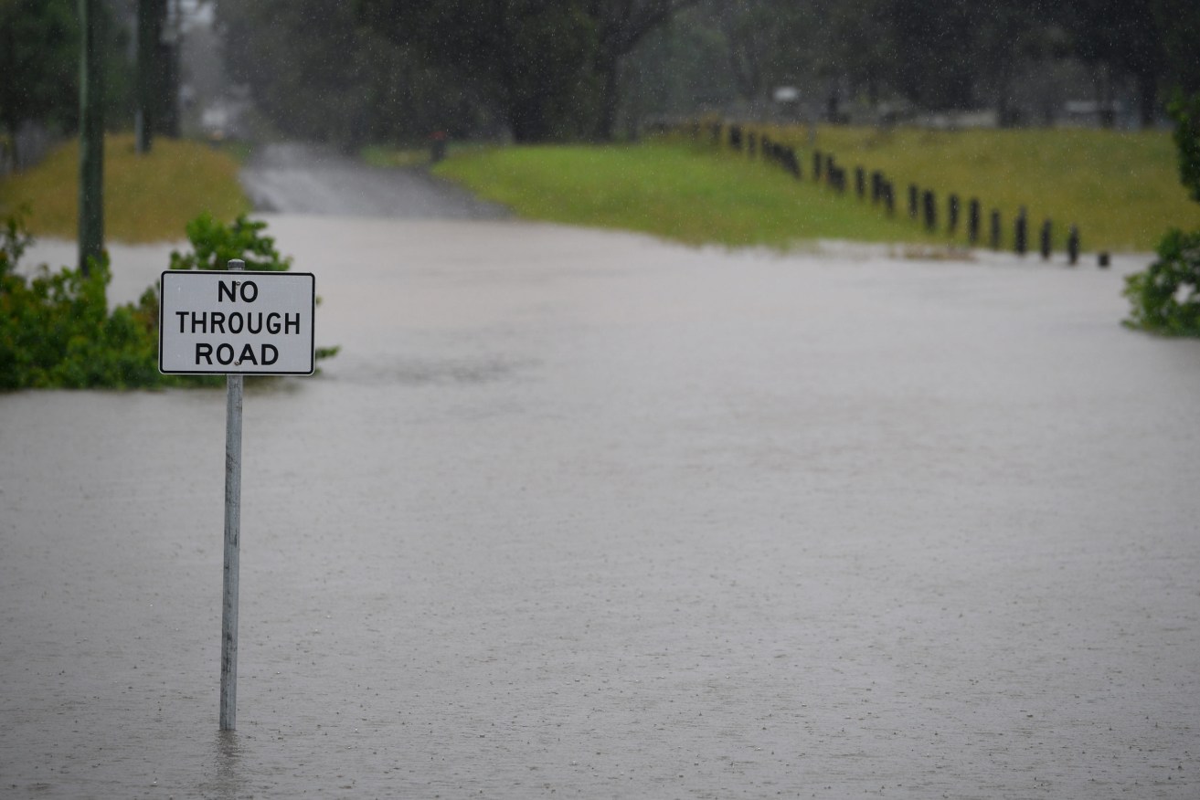 Queensland's expected record May rain event is being felt in the north.(AAP Image/Dan Himbrechts) 