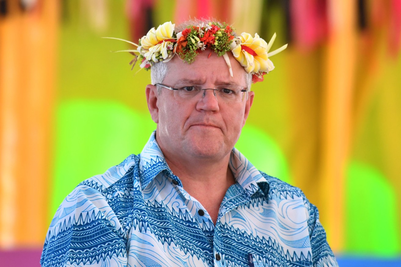 Prime Minister Scott Morrison arrives for the Pacific Islands Forum in Funafuti, Tuvalu, back in August, 2019. The government's handling of Pacific relationships has become a campaign burden. (AAP Image/Mick Tsikas)
