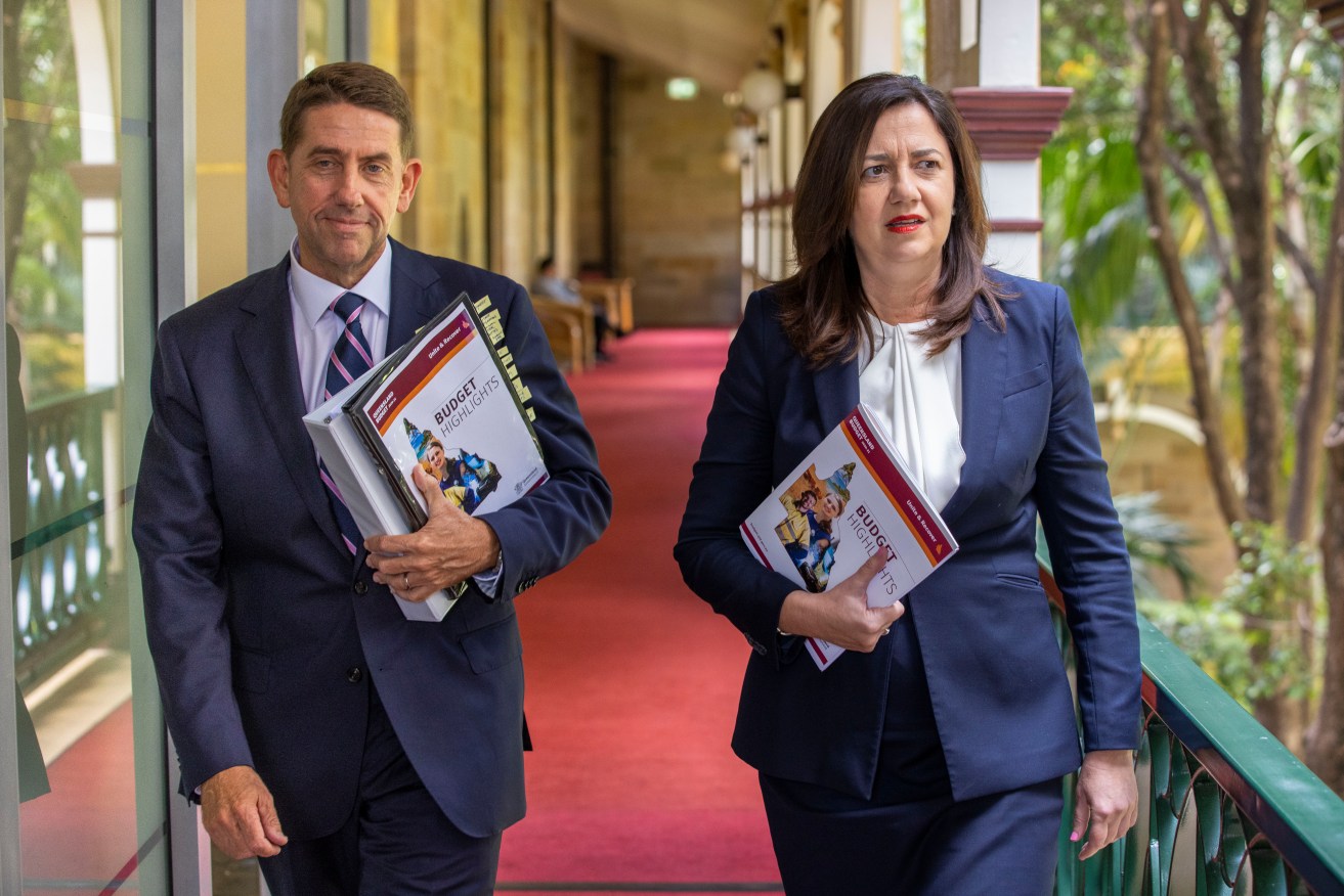 Queensland Treasurer Cameron Dick and Queensland Premier Annastacia Palaszczuk arrive to give a briefing to journalists during the 2020-21 Queensland State Budget. (AAP Image/Glenn Hunt) 