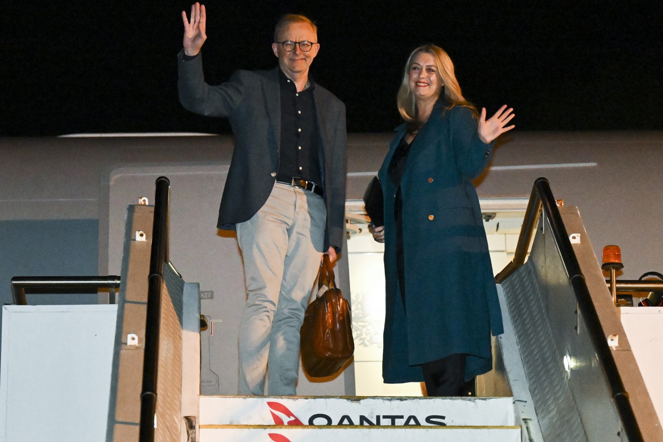 Australian Prime Minister Anthony Albanese and partner Jodie Haydon board the plane to Europe for a NATO Leaders’ Summit, in Sydney, Sunday, June 26, 2022. Albanese will join leaders of Japan, South Korea, and New Zealand to attend a NATO Leaders’ Summit in Spain, before flying to France. (AAP Image/Lukas Coch) 